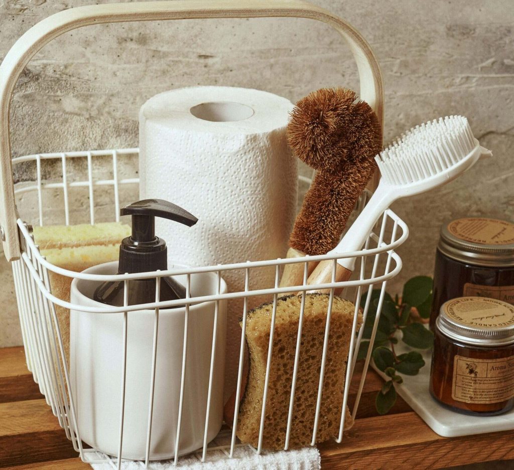 a white basket filled with lots of bathroom items