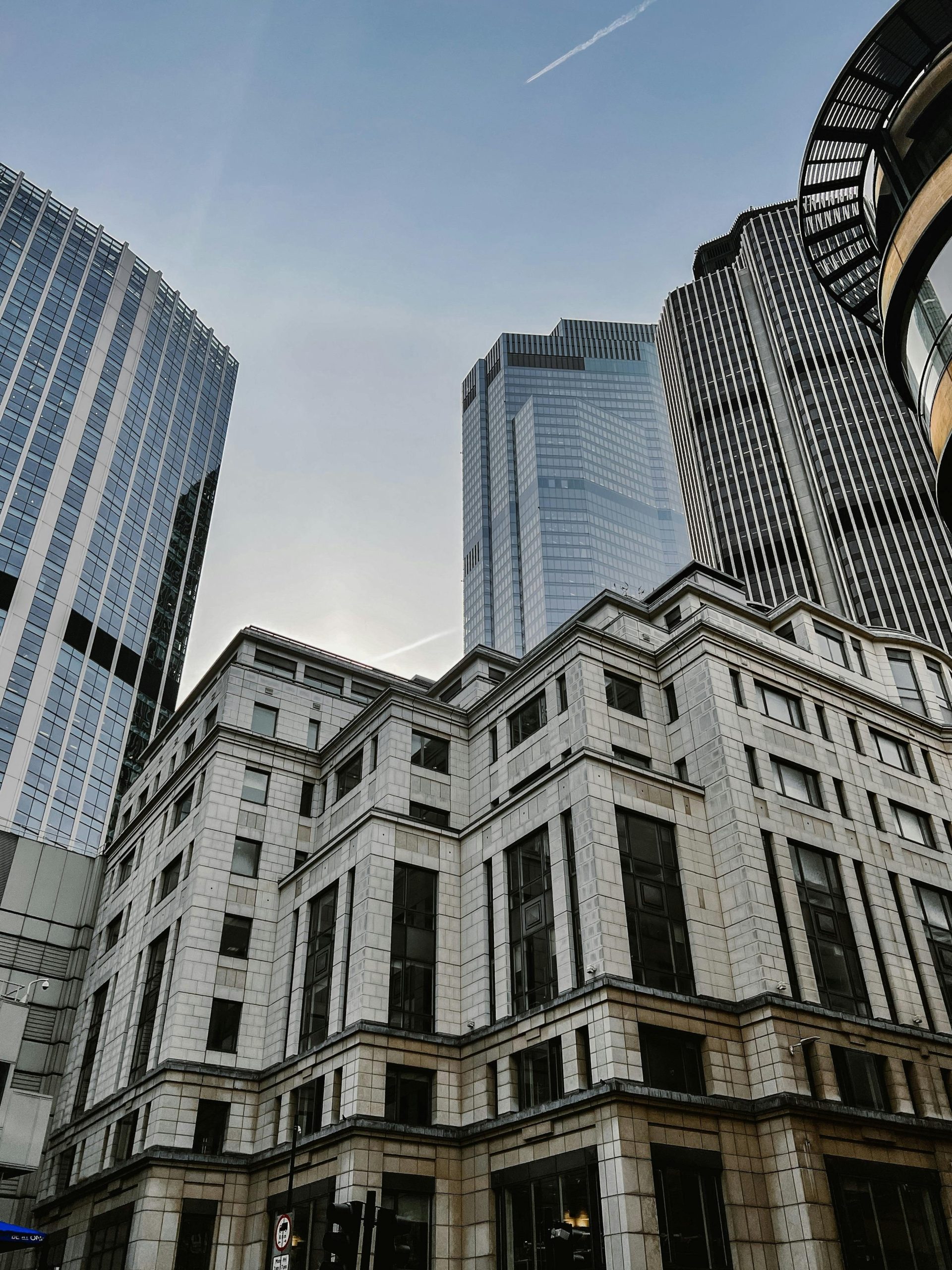 A stunning view of modern skyscrapers framed by urban architecture in downtown London.
