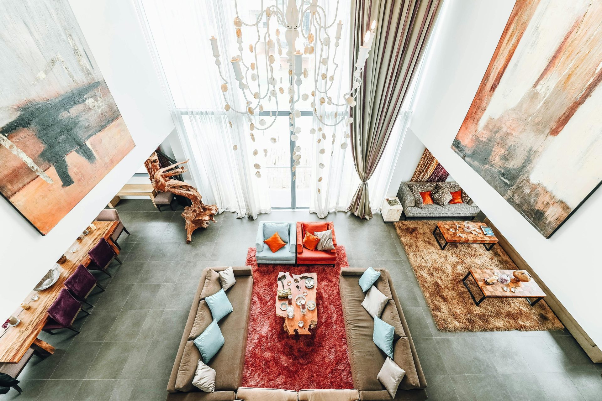 Aerial view of a luxurious modern living room with elegant furniture and artwork.